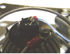 Non-SR 111 FCRL (map light) with arcing on contact spring with carrier frame